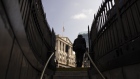 A commuter leaves the London Underground in view of the Bank of England (BOE) in the City of London, UK, on Monday, June 19, 2023. The squeeze on finances for thousands of British homeowners is set to intensify after a key rate on mortgage borrowing climbed to its highest level since December. Photographer: Jason Alden/Bloomberg